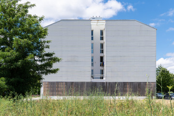 Fototapeta na wymiar Building facade with metallic cladding
