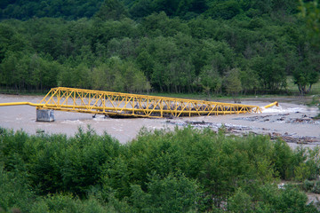 broken by flood on the river gas main pipe at the mouth of the Teberda river to the village of...
