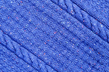 Abstract textured background of close up detail of knitting in a handmade sweater