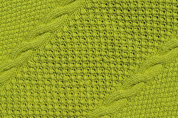 Abstract textured background of close up detail of knitting in a handmade sweater