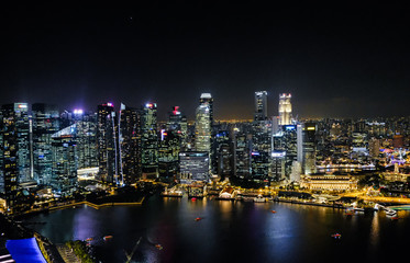 Fototapeta na wymiar Night cityscape of Singapore. Skyscrapers at night. Business part of Singapore city at night.