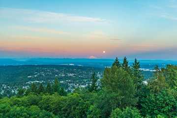 Stunning sunset over distant Mount Baker, highlighted by Full Moon rising - from UniverCity at Burnaby Mountain, Summer