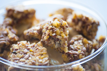 Granola with Greek yogurt in a glass beaker, close-up macro. Healthy and natural food, delicious breakfast.