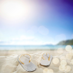 Summer flip flops on beach and free space for your decoration. Summer time. 