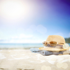 Summer sunglasses on sand and free space for your decoration. 