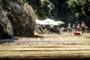 Desk of free space and summer blurred background of beach with sea 