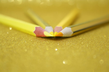 YELLOW PENCILS OVER GOLDEN BRIGHT