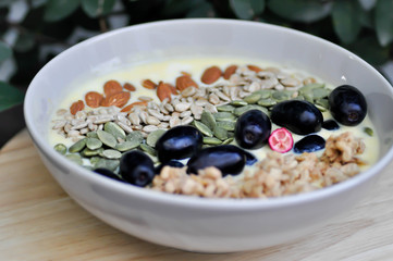 smoothie bowl,mango yogurt with fruit and almond