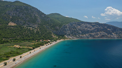 Aerial panoramic photo of famous sandy beach of Psatha in West Attica with emerald clear sea, Corinthian gulf, Greece