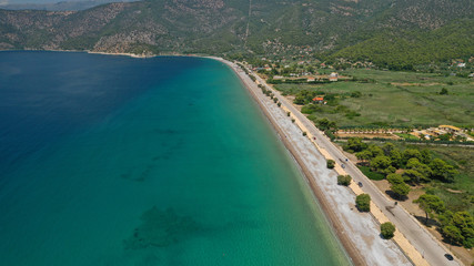 Aerial panoramic photo of famous sandy beach of Psatha in West Attica with emerald clear sea, Corinthian gulf, Greece