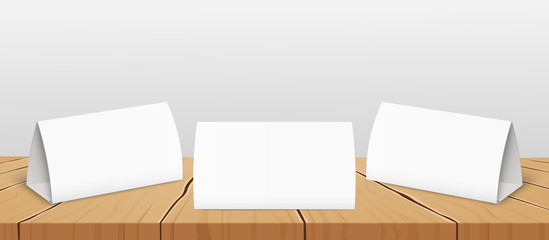 Set of three blank table tent cards to presentate design realistic vector mockup.