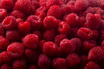 Fresh ripe raspberries background closeup photo