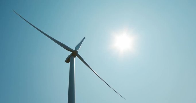 Wind turbines on beautiful sunny summer landsape Eolic park.