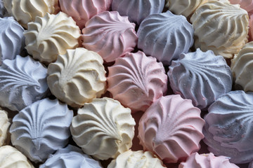 Multicolor fruity zephyr. Closeup of dessert with raspberry, blueberry and banana flavor. Natural product, ready for sale.