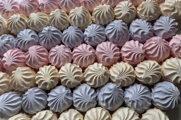 Multicolor fruity zephyr. Closeup of dessert with raspberry, blueberry and banana flavor. Natural product, ready for sale.