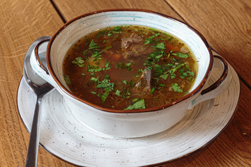 A clear soup made with lamb, herbs and concentrated stock.