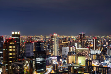 Fototapeta na wymiar Night skyline of Osaka city. Umeda Sky Building in Japan.
