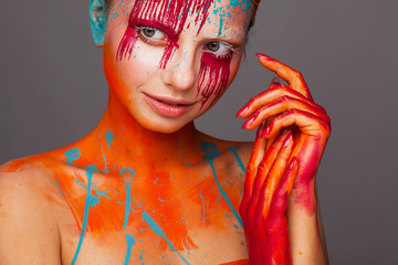 Portrait of a model in an expressive creative style using an unusual make-up