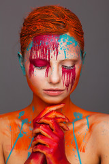 Portrait of a model in an expressive creative style using an unusual make-up