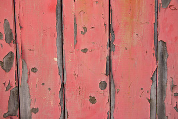 Pink painted worn metal surface