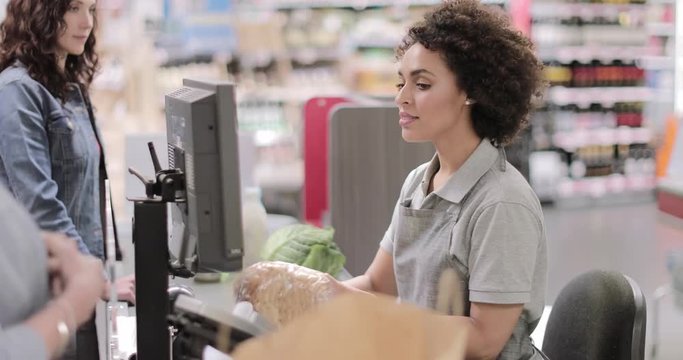 Sales clerk working at grocery store