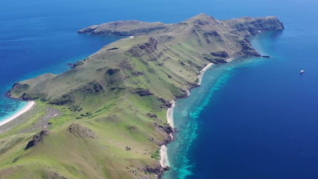 A beautiful coral reef fringes the tropical island of Gili Banta just outside of Komodo National Park. This scenic area of Indonesia is known for its spectacular tropical marine biodiversity.