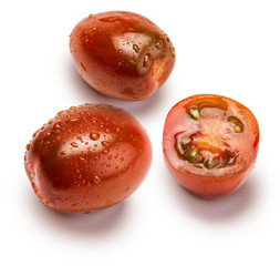 Fototapeta premium Close-up of cherry tomatoes (mini kumakos) cut in half and whole. With drops of water. Isolated on white background.