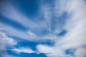 Fototapeta premium Deep blue summer sky with clouds. Mockup background 