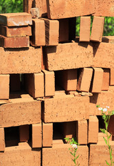 Heap of red bricks on pallet