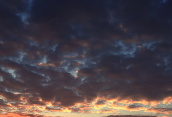 Naklejka na ściany i meble Colorful clouds at sundown on sky