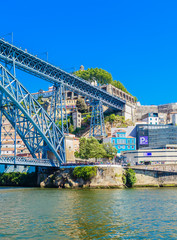 Famous steel bridge dom Luis above connects Old town Porto with Vila Nova de Gaia at river Douro, Portugal.