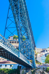 Fototapeta premium Fragment of famous steel bridge dom Luis above connects Old town Porto with Vila Nova de Gaia at river Douro, Portugal.