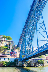 Fragment of famous steel bridge dom Luis above connects Old town Porto with Vila Nova de Gaia at river Douro, Portugal.