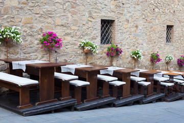 Restaurant tables on a street, Tuscany in Italy