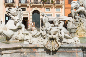 Detail of The Fountain of Neptune (Italian: Fontana del Nettuno). Sculpture of cupids, walruse and horse. Sculptures by Antonio Della Bitta and Gregorio Zappalà.