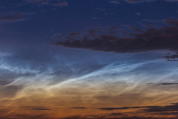 noctilucent clouds at midnight in the sky