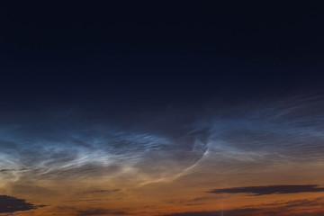 Fototapeta na wymiar noctilucent clouds at midnight in the sky