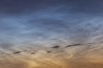 noctilucent clouds at midnight in the sky