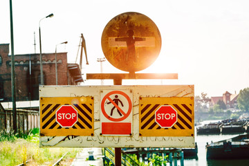 Signs, no entry, stop. Against the sun