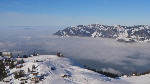 Pan from high-altitude mountain summit over valley with cloud inversion (Klewenalp-Vierwaldst&auml;ttersee Switzerland)