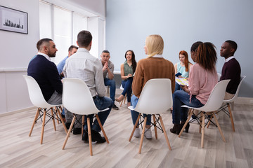 Multi-ethnic People Sitting In Circle Counseling