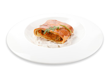 Pancake with mushroom filling isolated on white