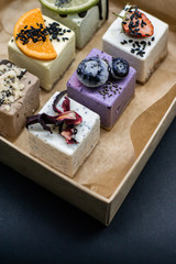 Raw vegan desserts in the box with fresh berries