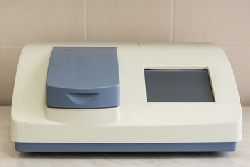 Scientist working at the laboratory with Spectrophotometer, cholesterol test lab and optical density determine