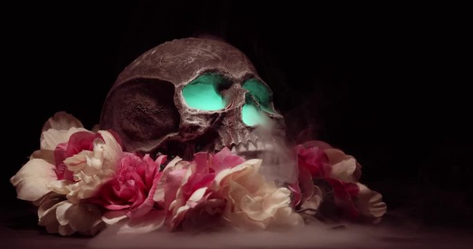 Green Eyed Smoking Skull Among Flowers on Black