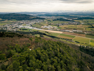 Fototapeta na wymiar Aerial view urban sprawl Jura mountains in Switzerland