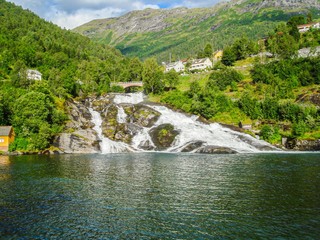 Norwegian fjords. Mountain valley landscape. Mountain river waterfall landscape. Nature background.