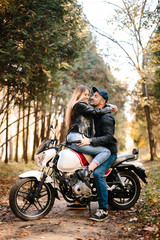 Fototapeta na wymiar young couple on motorcycle laugh