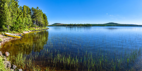 Fototapeta na wymiar Panoramic view at Siebdniesjavrrie lake in Swedish Lapland. Vasterbotten county, Norrland, Sweden.