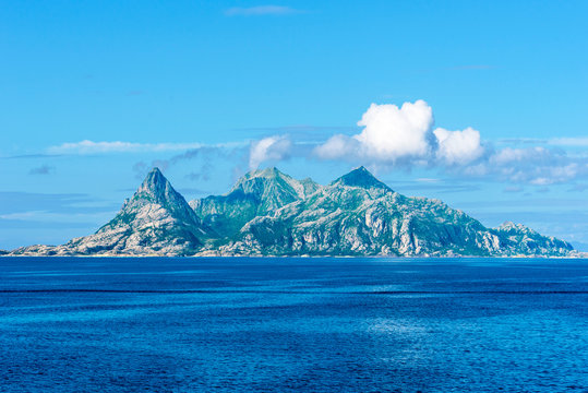 Landegode island as seen from west, Bodo Municipality, Nordland county of Norway. Water surface of Norwegian Sea is at foreground.